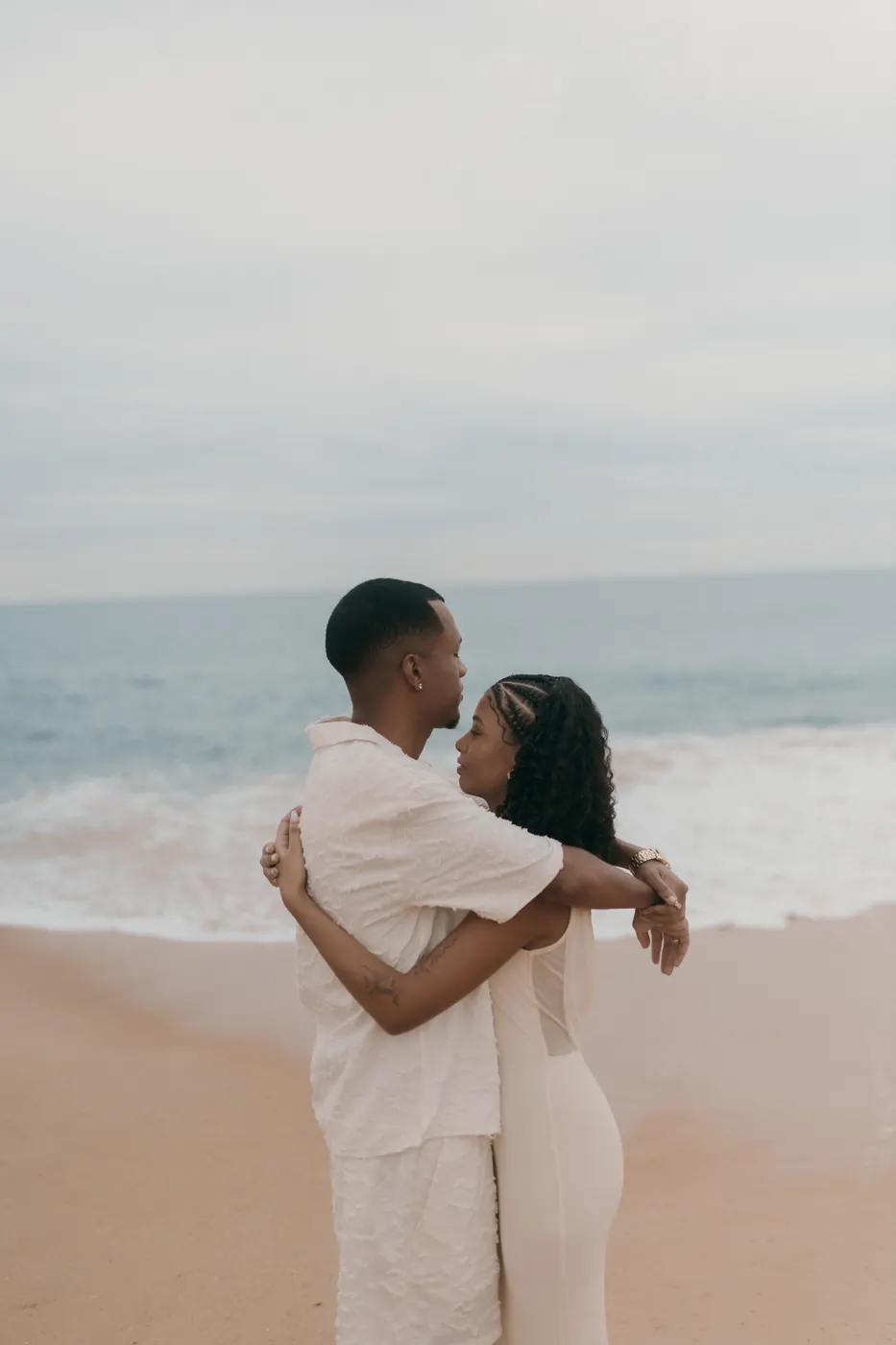 Illustrative Black couple embracing beside the ocean for a faith-and-values dating guide
